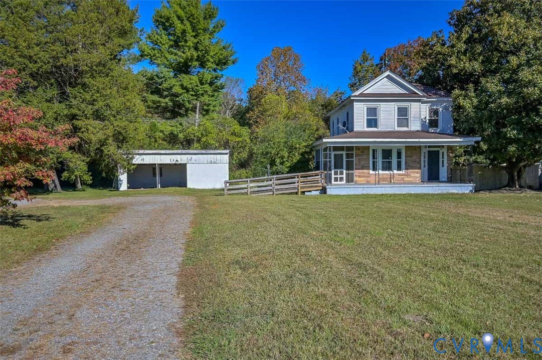 17519 New Baltimore Road Milford, VA 22514 - Photo 3 of 38 a front view of a house with a yard and trees