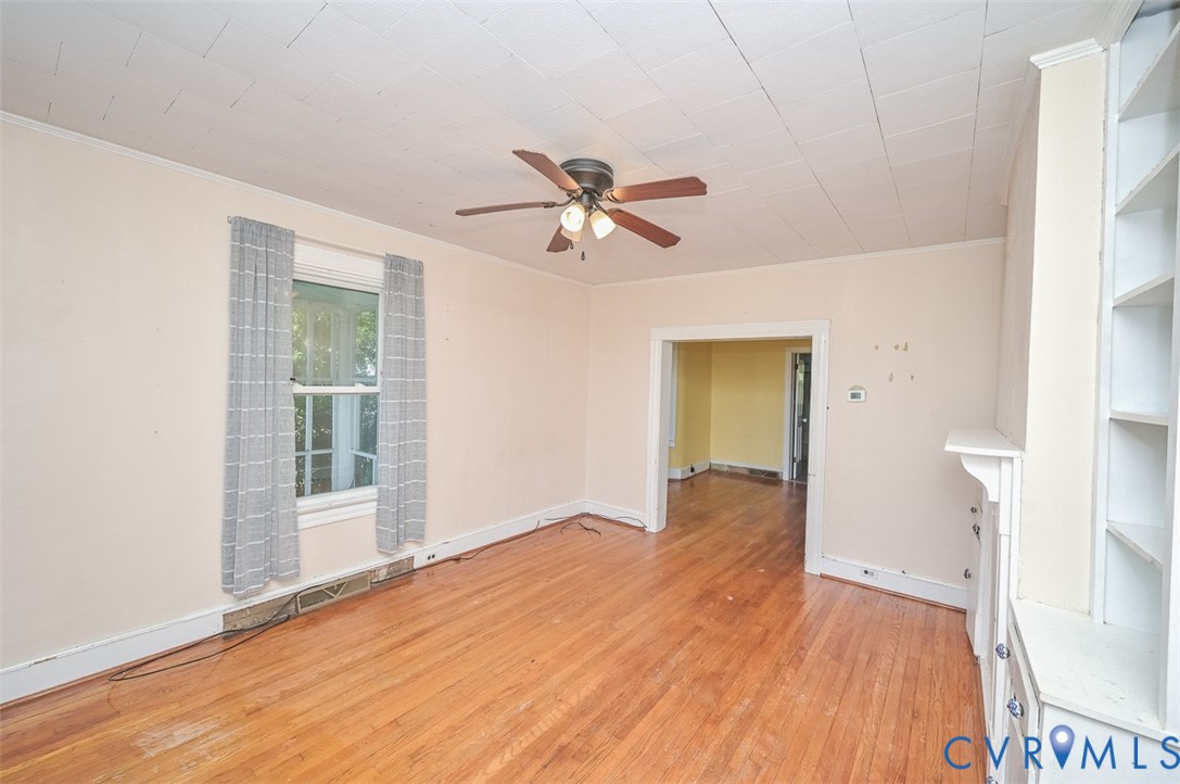 17519 New Baltimore Road Milford, VA 22514 - Photo 9 of 38 wooden floor in an empty room with a window
