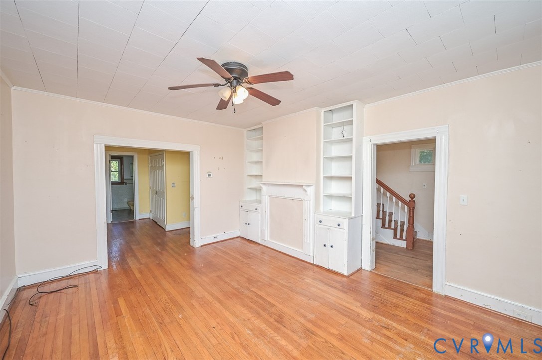17519 New Baltimore Road Milford, VA 22514 - Photo 10 of 38 a view of empty room with wooden floor and ceiling fan