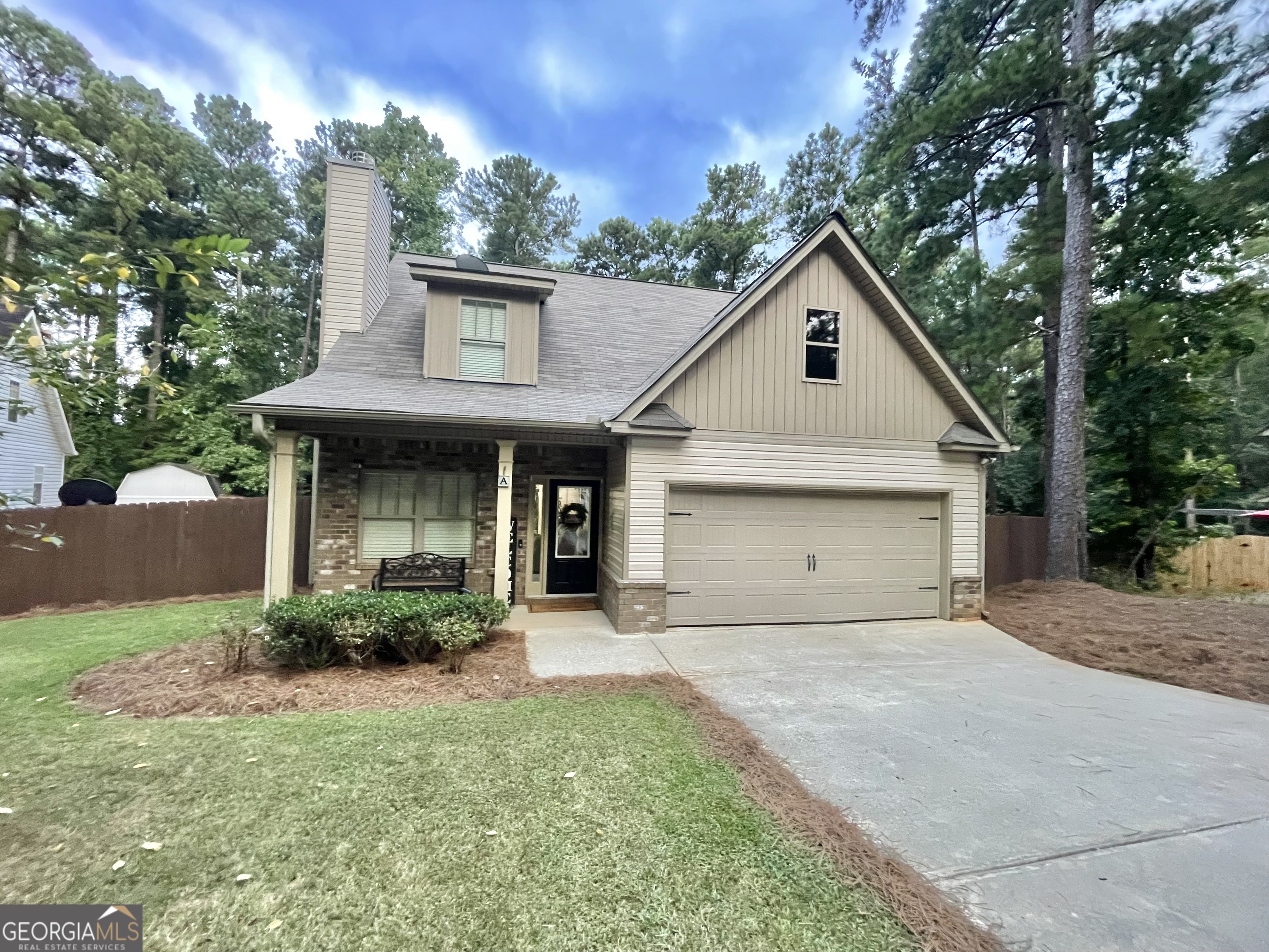 57 Partridge Court Monticello, GA 31064 - Photo 1 of 57 a front view of a house with garage and plants