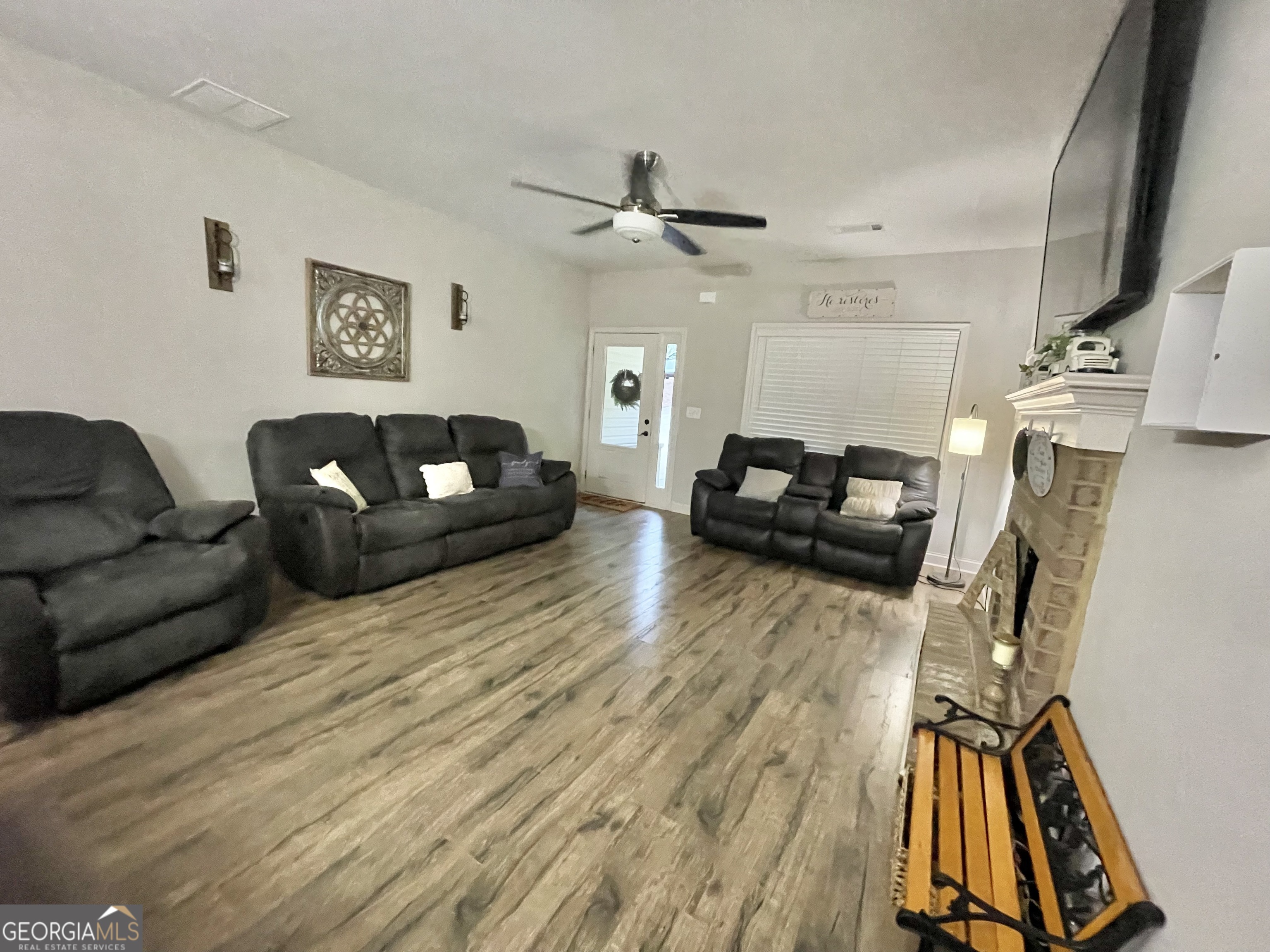 57 Partridge Court Monticello, GA 31064 - Photo 23 of 57 a living room with furniture and a wooden floor