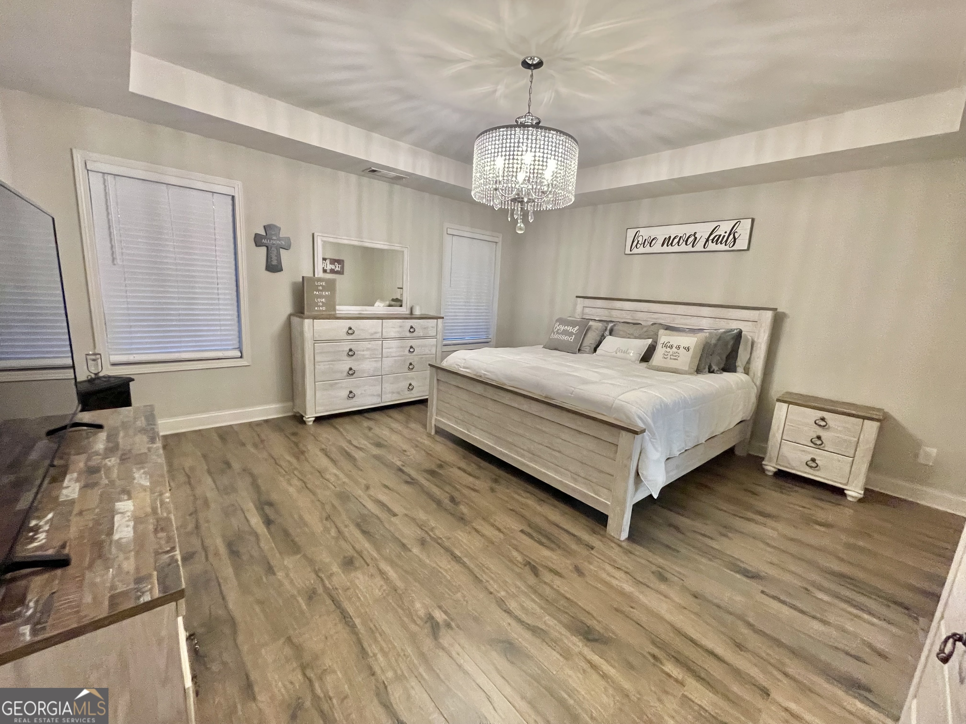 57 Partridge Court Monticello, GA 31064 - Photo 30 of 57 a spacious bedroom with a bed and a chandelier