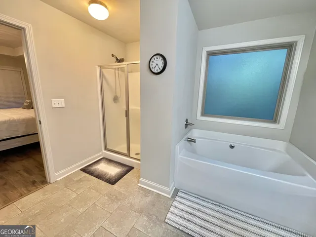 a bathroom with a sink a mirror and a shower