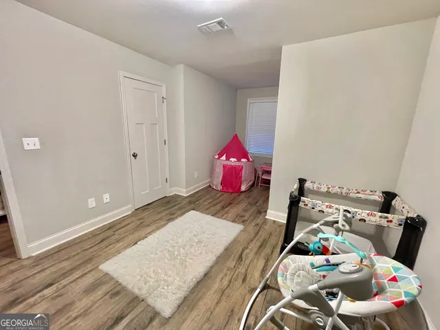 a white toilet sitting next to a bathroom sink