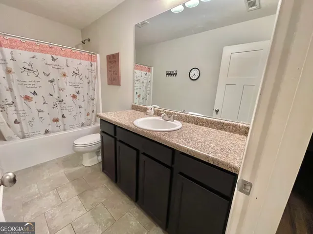 a view of a hallway view with wooden floor and staircase