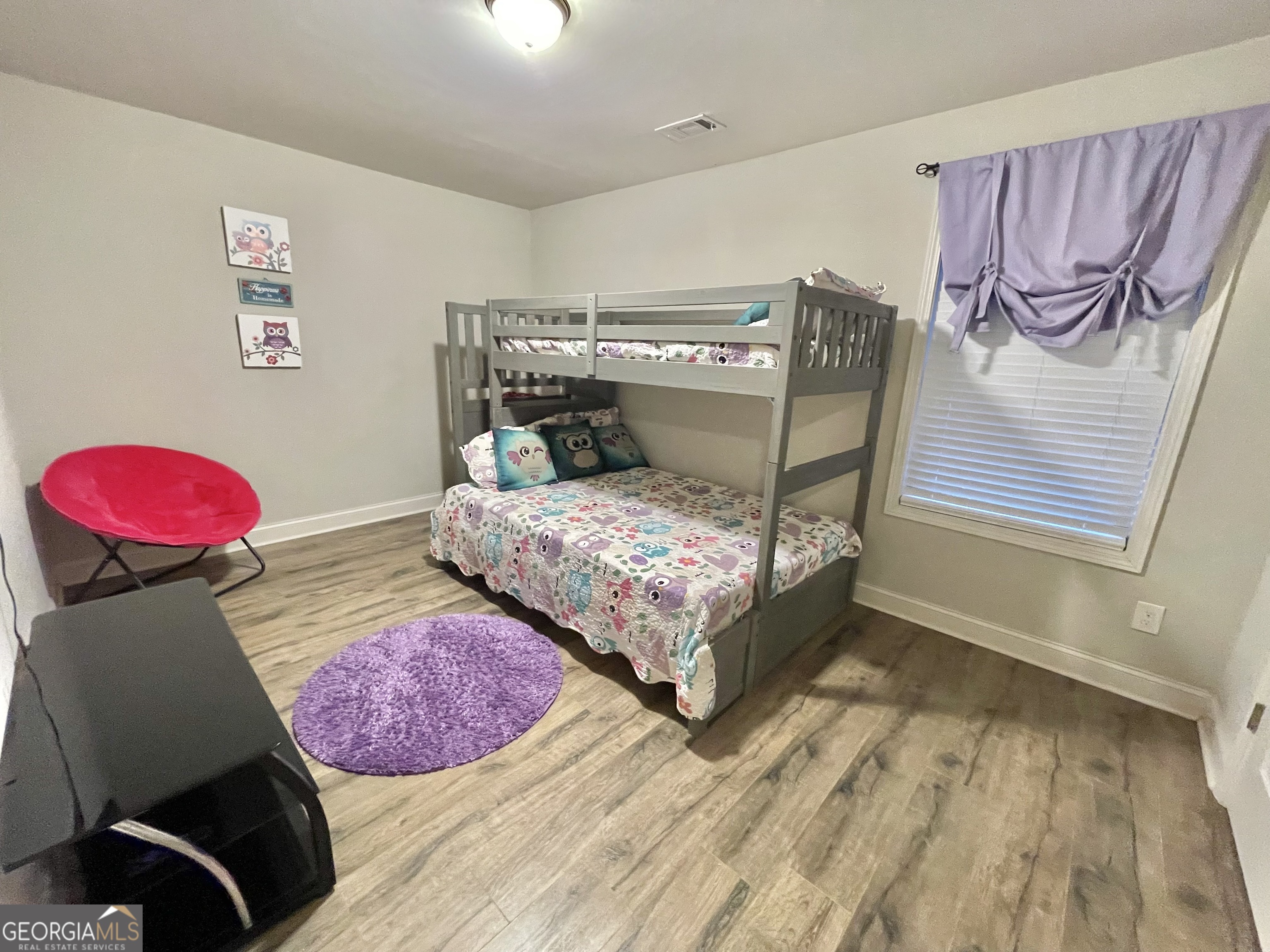 57 Partridge Court Monticello, GA 31064 - Photo 49 of 57 a bedroom with a bed and a dresser with the shoe rack