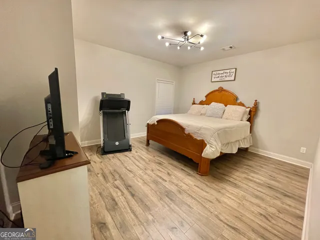 a view of a hallway view with wooden floor