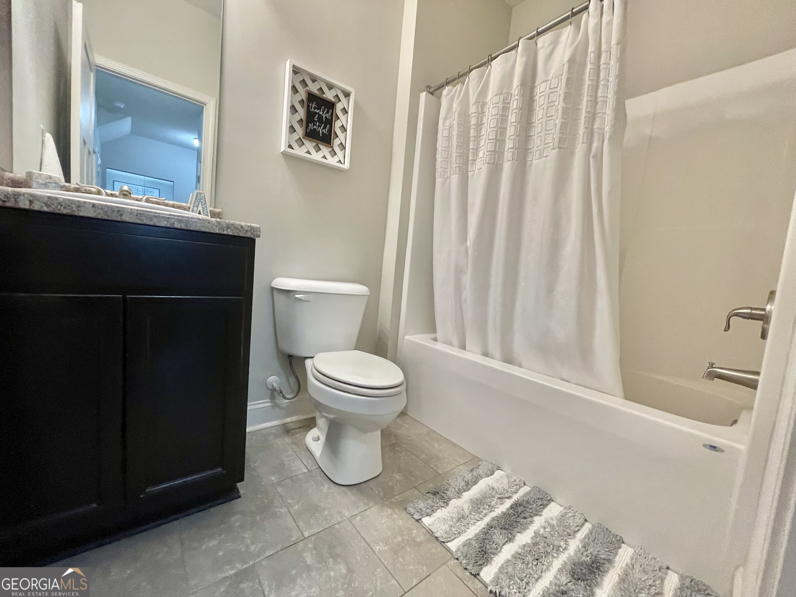 57 Partridge Court Monticello, GA 31064 - Photo 52 of 57 a white toilet sitting next to a bathroom sink