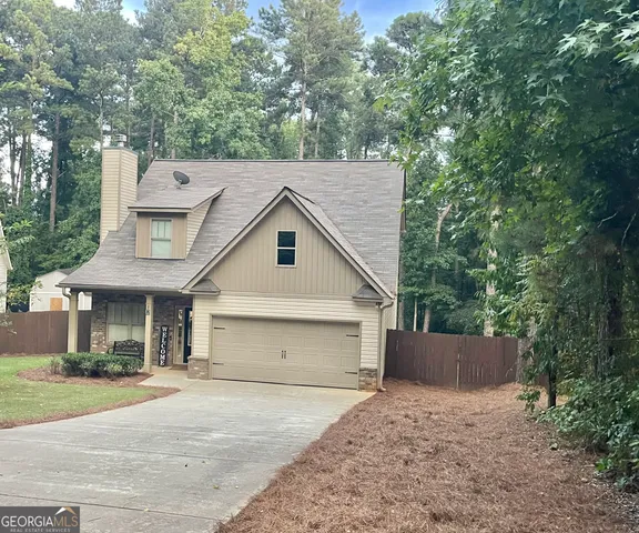 a front view of a house with garage