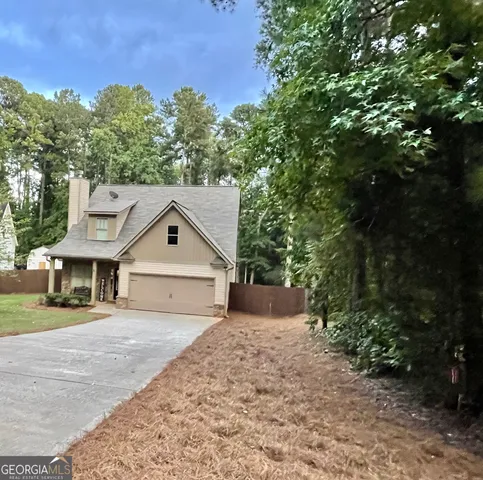 a view of two chairs in the balcony