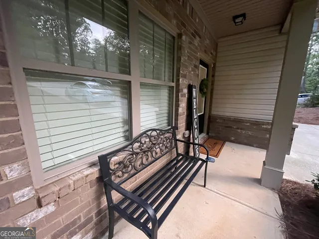 a living room with furniture and a yard