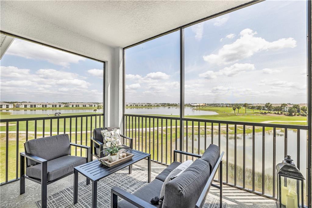 43989 Boardwalk Loop, Unit 2032 Punta Gorda, FL 33982 - Photo 1 of 14 a balcony with wooden floor view