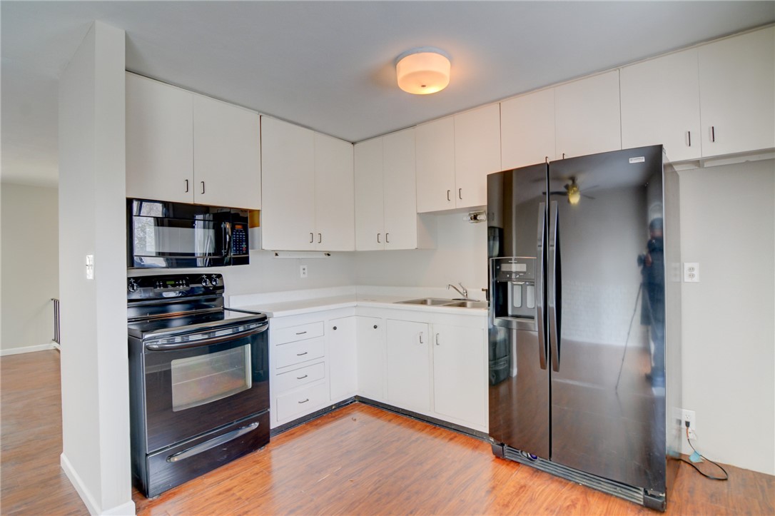 35 Whippoorwill Drive Decatur, IL 62526 - Photo 8 of 33 a kitchen with stainless steel appliances a refrigerator stove and microwave