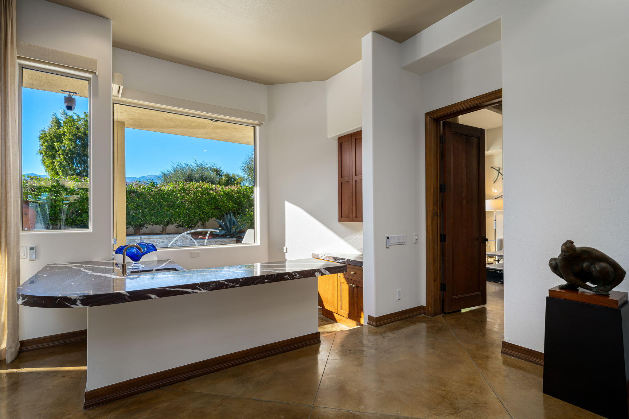 103 Waterford Circle Rancho Mirage, CA 92270 - Photo 12 of 44 a living room with furniture and a window
