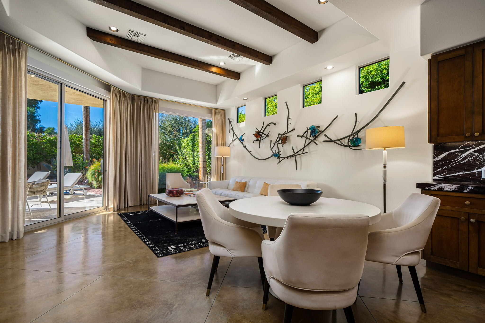 103 Waterford Circle Rancho Mirage, CA 92270 - Photo 19 of 44 a view of a dining room with furniture window and outside view