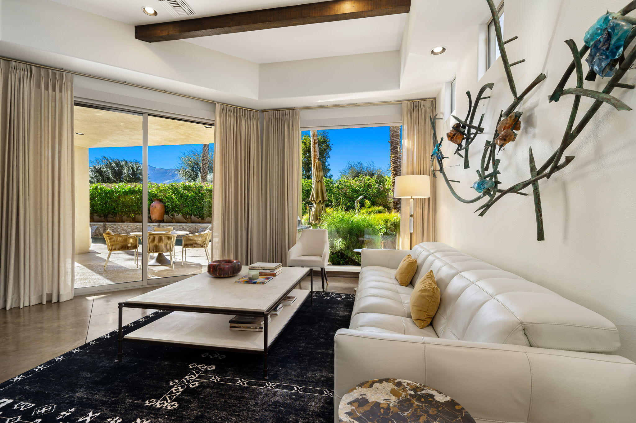 103 Waterford Circle Rancho Mirage, CA 92270 - Photo 21 of 44 a living room with furniture and a large window