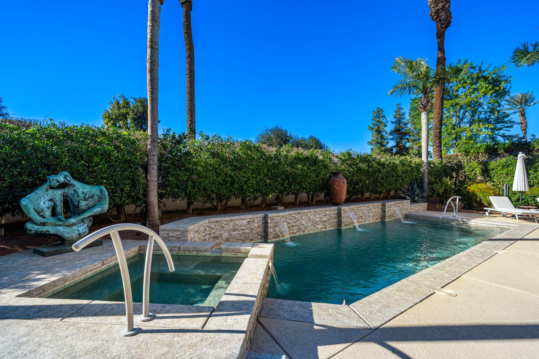 103 Waterford Circle Rancho Mirage, CA 92270 - Photo 27 of 44 a view of a swimming pool with a patio