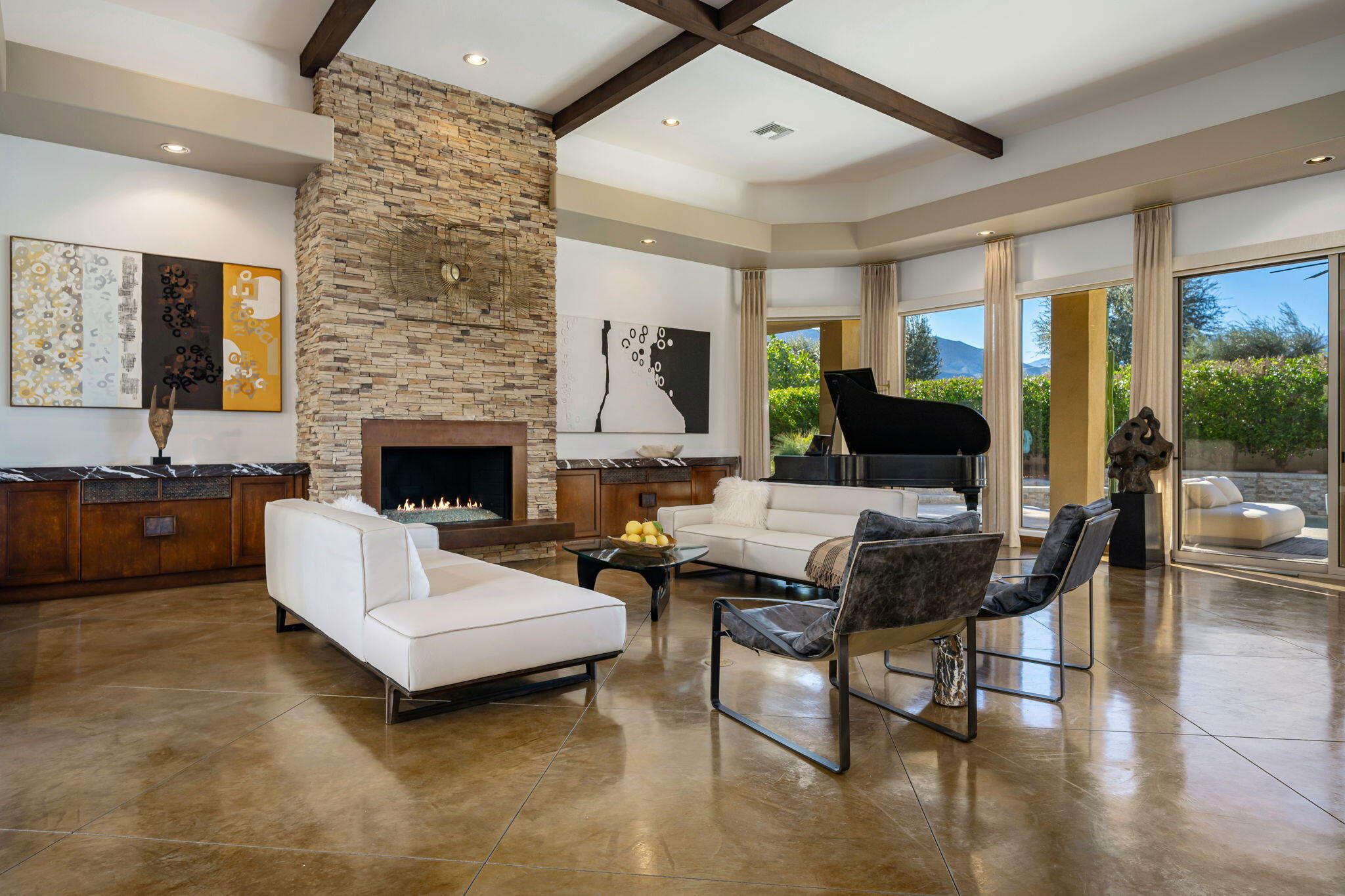 103 Waterford Circle Rancho Mirage, CA 92270 - Photo 5 of 44 a living room with furniture and a fireplace