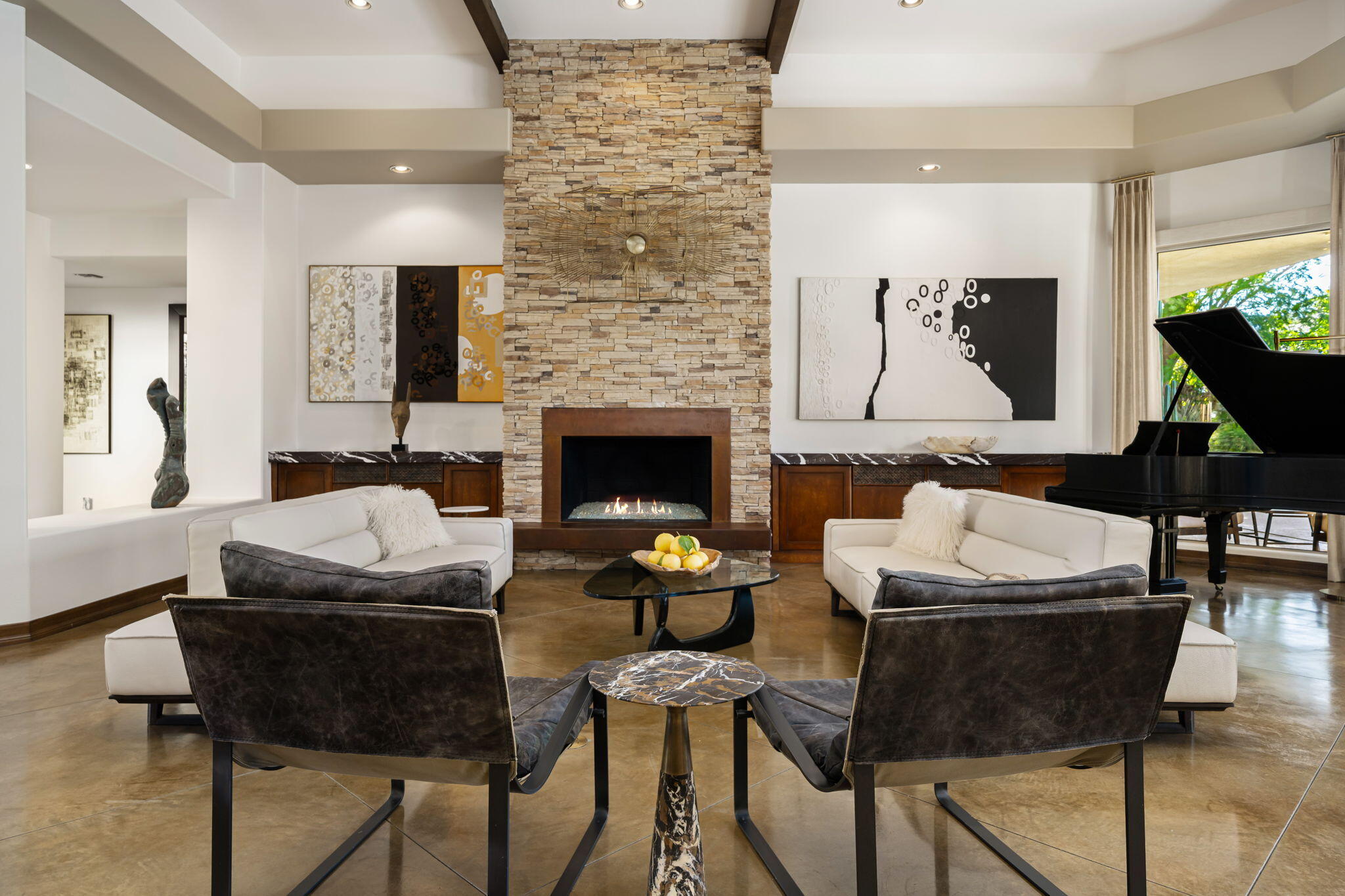 103 Waterford Circle Rancho Mirage, CA 92270 - Photo 6 of 44 a living room with furniture and a fireplace