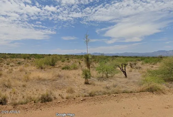 a view of a road with an ocean beach