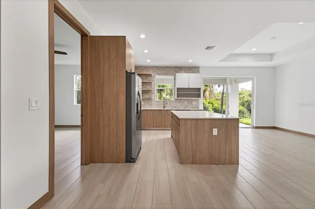 a view of kitchen and wooden floor
