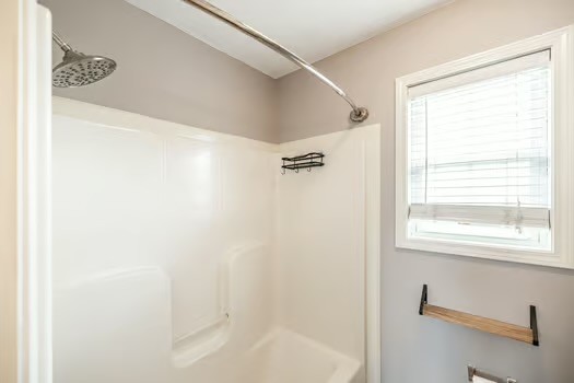 2029 Copper Kettle Circle Pleasant View, TN 37146 - Photo 53 of 58 a bathroom with a bathtub a shower and a window