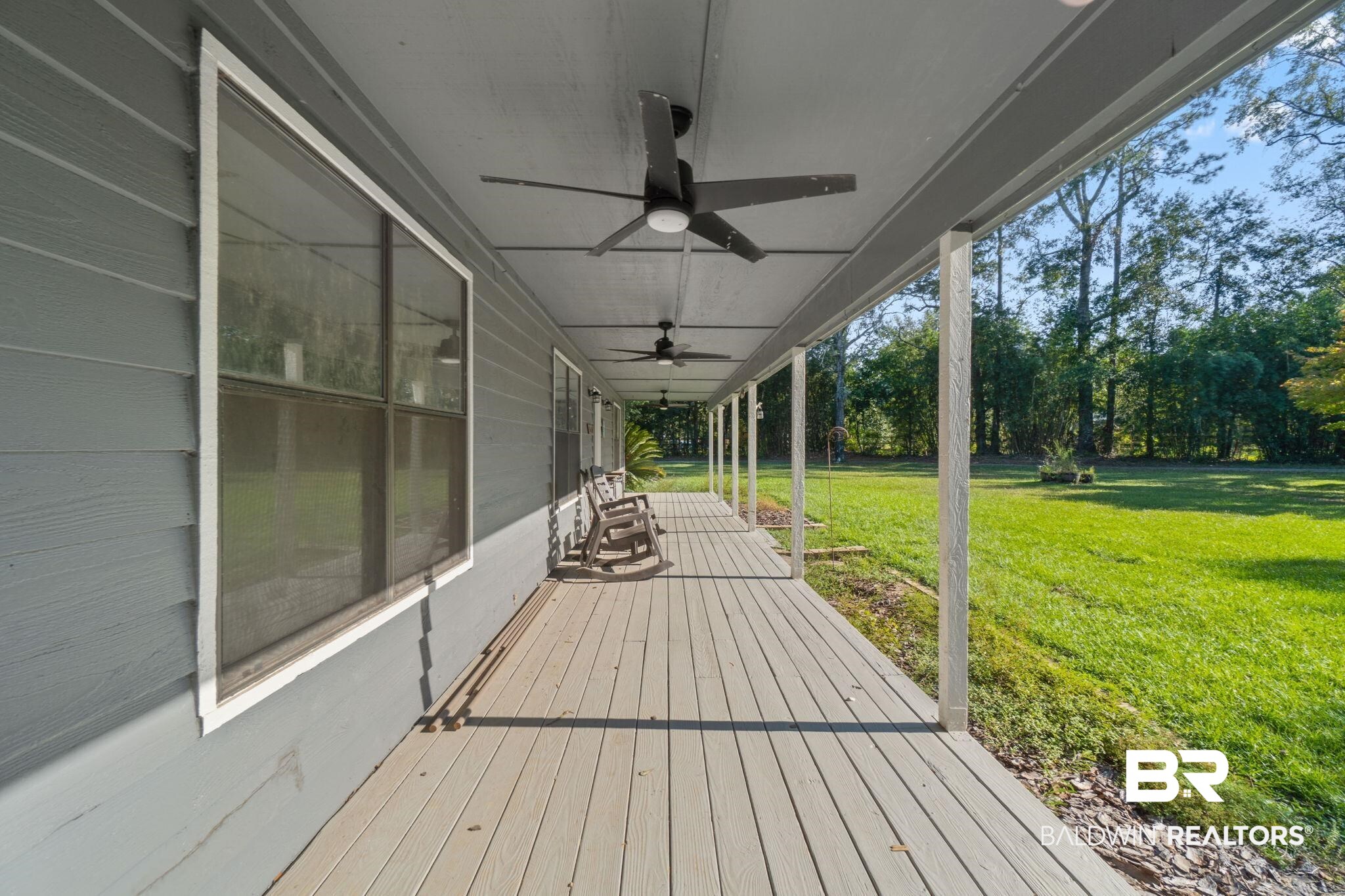27300 C R Watson Road Robertsdale, AL 36567 - Photo 32 of 35 Wooden deck featuring a yard and ceiling fan