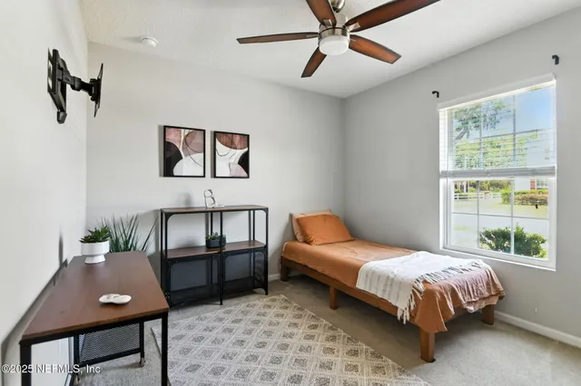 a bed room with a bed and a window