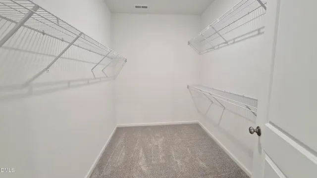 a view of a room with racks on the wall