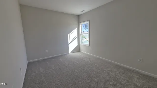 a view of empty room with windows