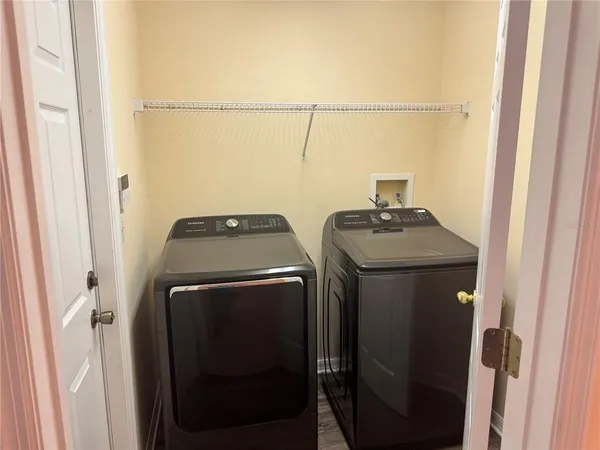 a utility room with dryer and washer