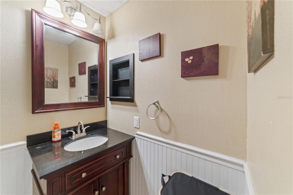 8715 Huntsman Lane Port Richey, FL 34668 - Photo 39 of 54 a bathroom with a sink and a mirror