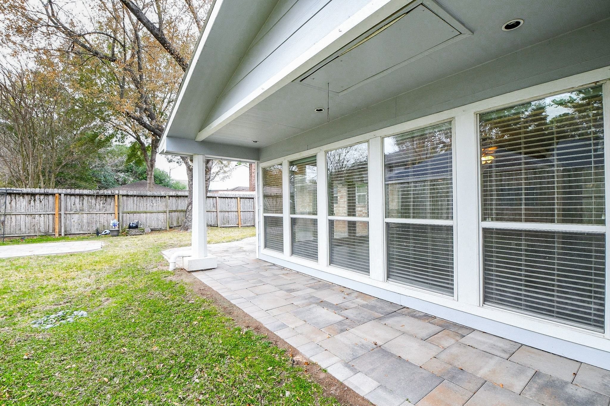 14011 Wickersham Lane Houston, TX 77077 - Photo 36 of 38 A covered seating area overlooking the spacious backyard.