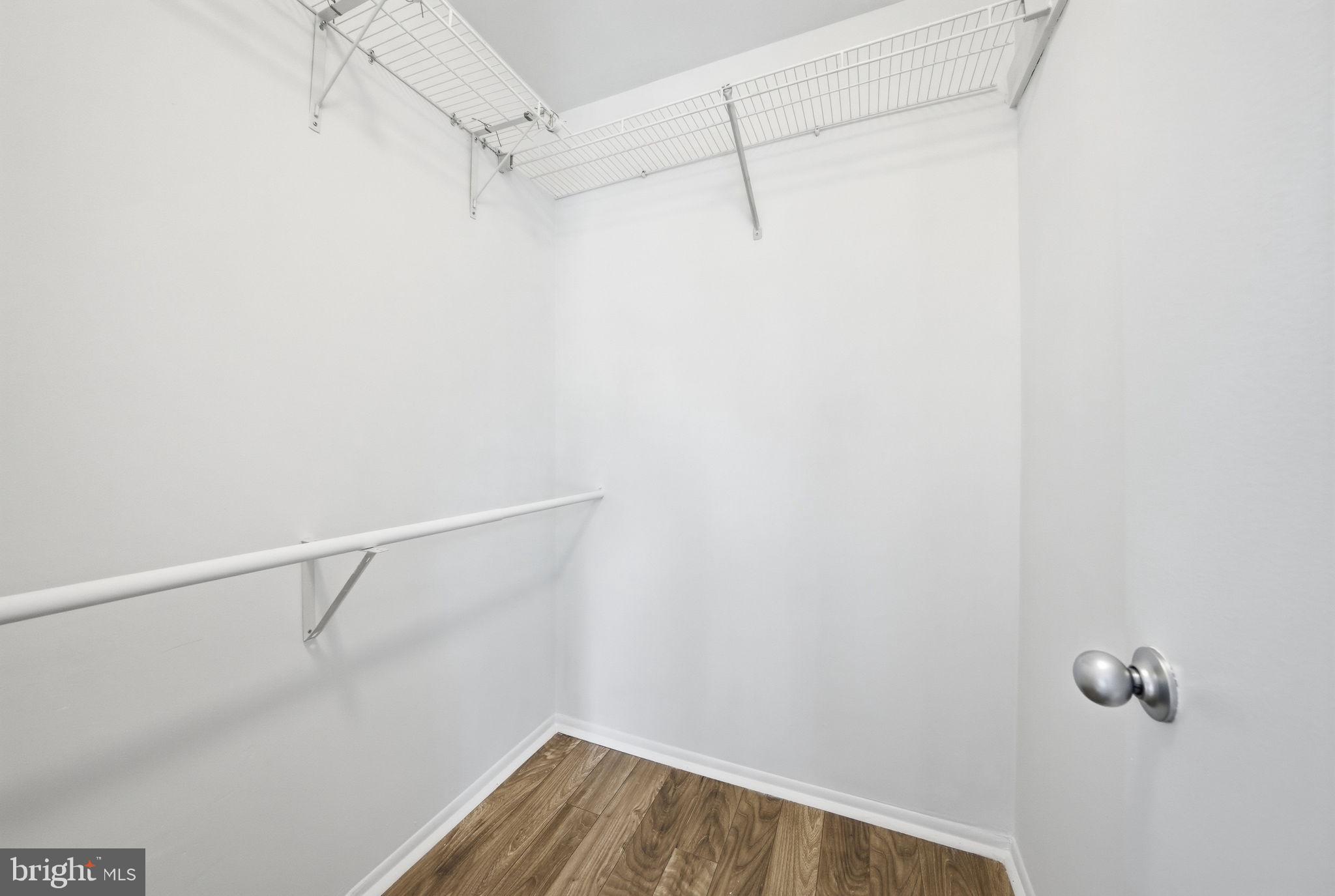 1703 Ascot Way, Unit D Reston, VA 20190 - Photo 18 of 21 a view of a room with racks on the wall
