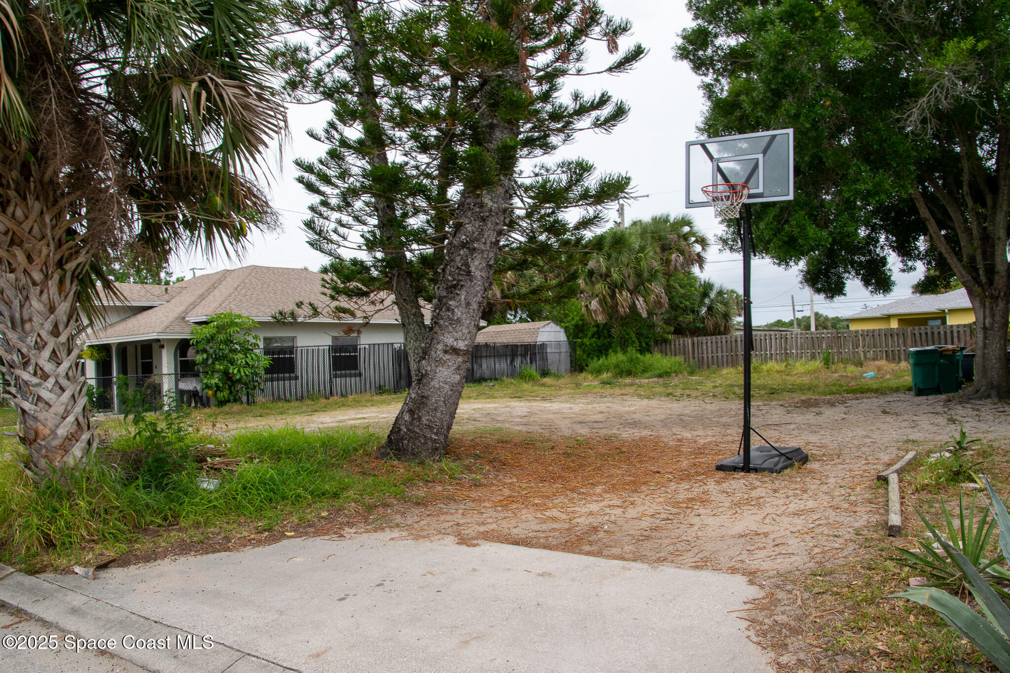 2902 Colbert Circle Melbourne, FL 32901 - Photo 2 of 2 a front view of a house with a yard