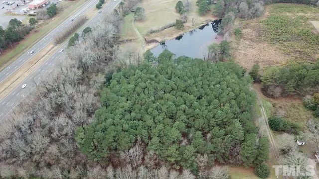 a view of a yard with a wooden bench