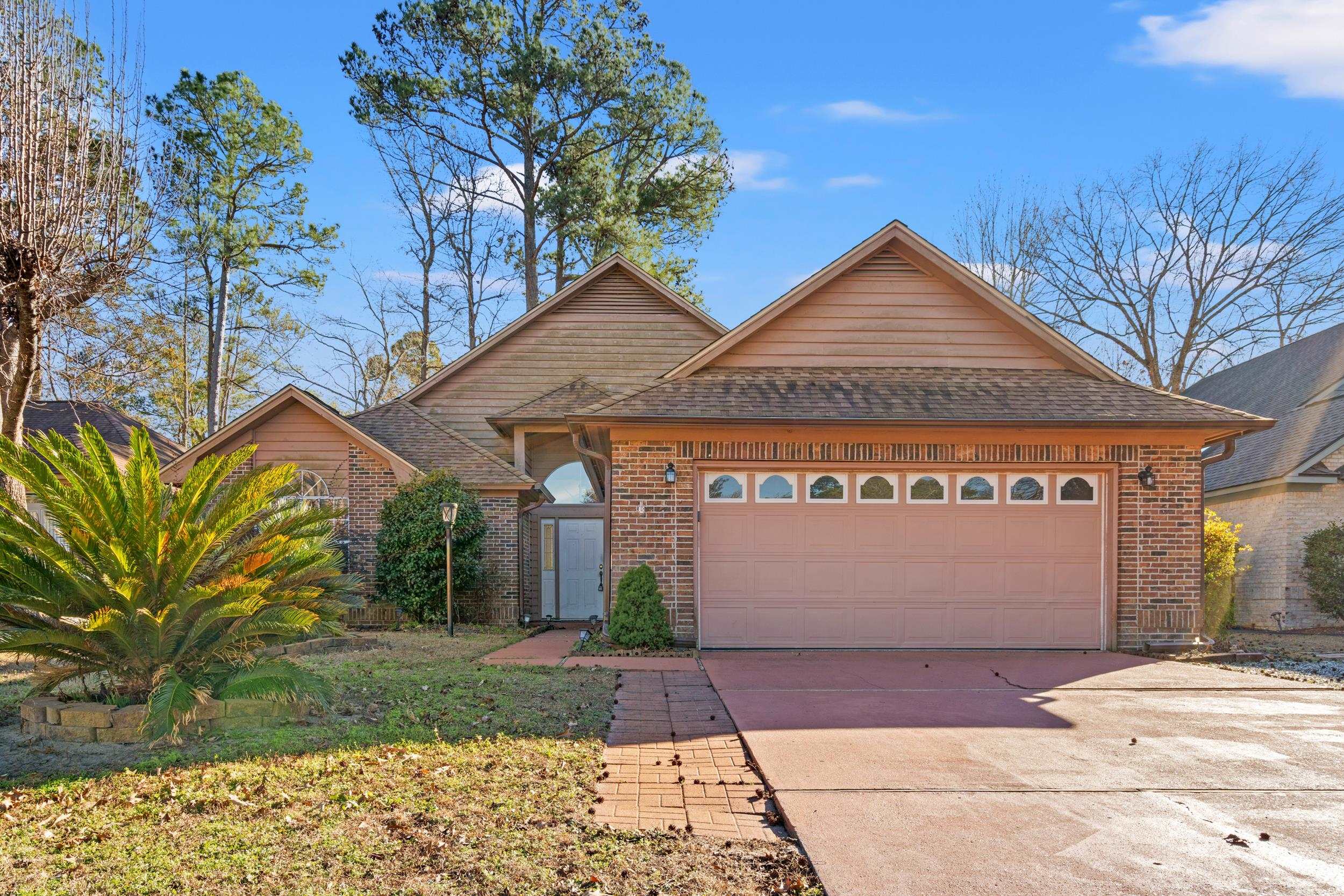 3106 Robyn Court Little River, SC 29566 - Photo 1 of 37 View of front of home featuring driveway, brick siding, a garage, and a shingled roof