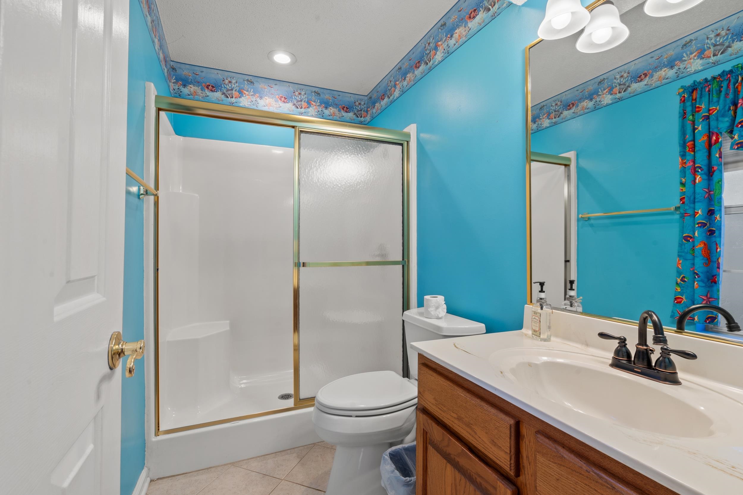 3106 Robyn Court Little River, SC 29566 - Photo 23 of 37 Full bath with a shower stall, vanity, and light tile patterned floors