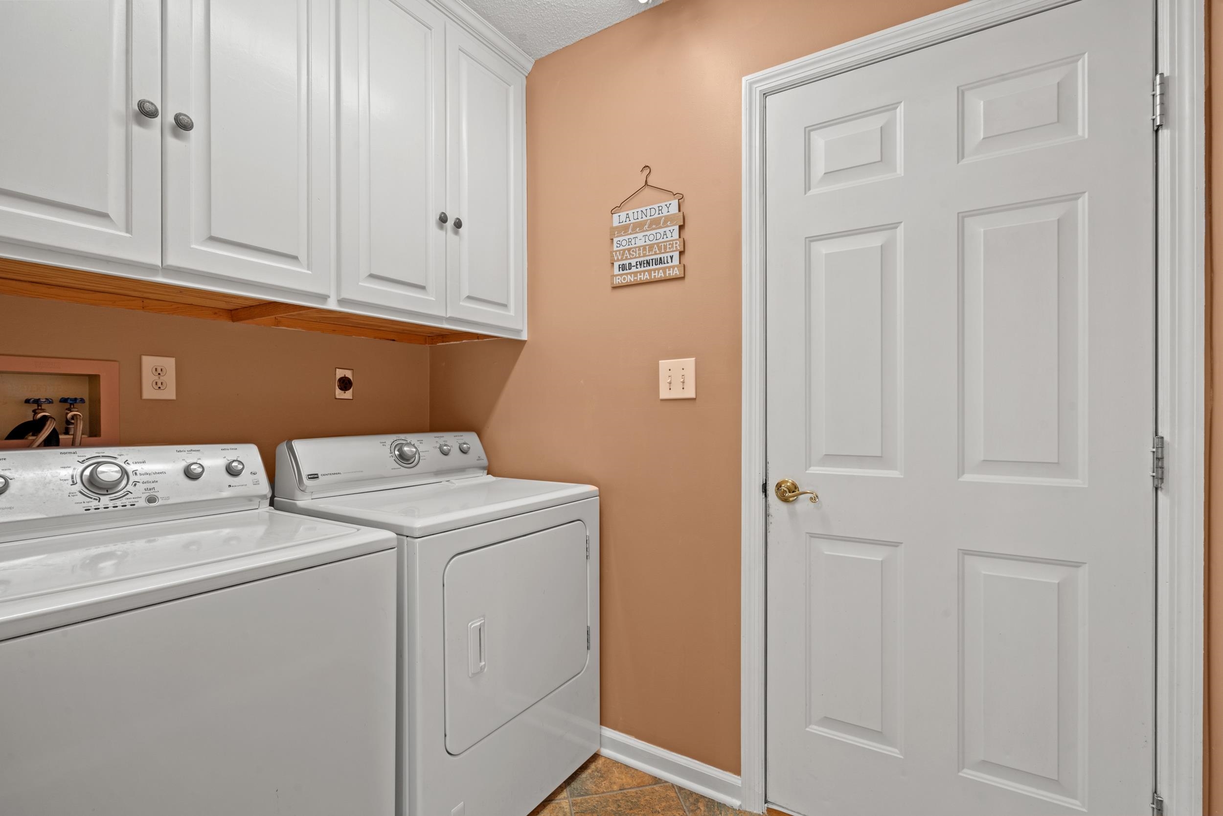 3106 Robyn Court Little River, SC 29566 - Photo 29 of 37 Laundry room featuring cabinet space and washer and clothes dryer