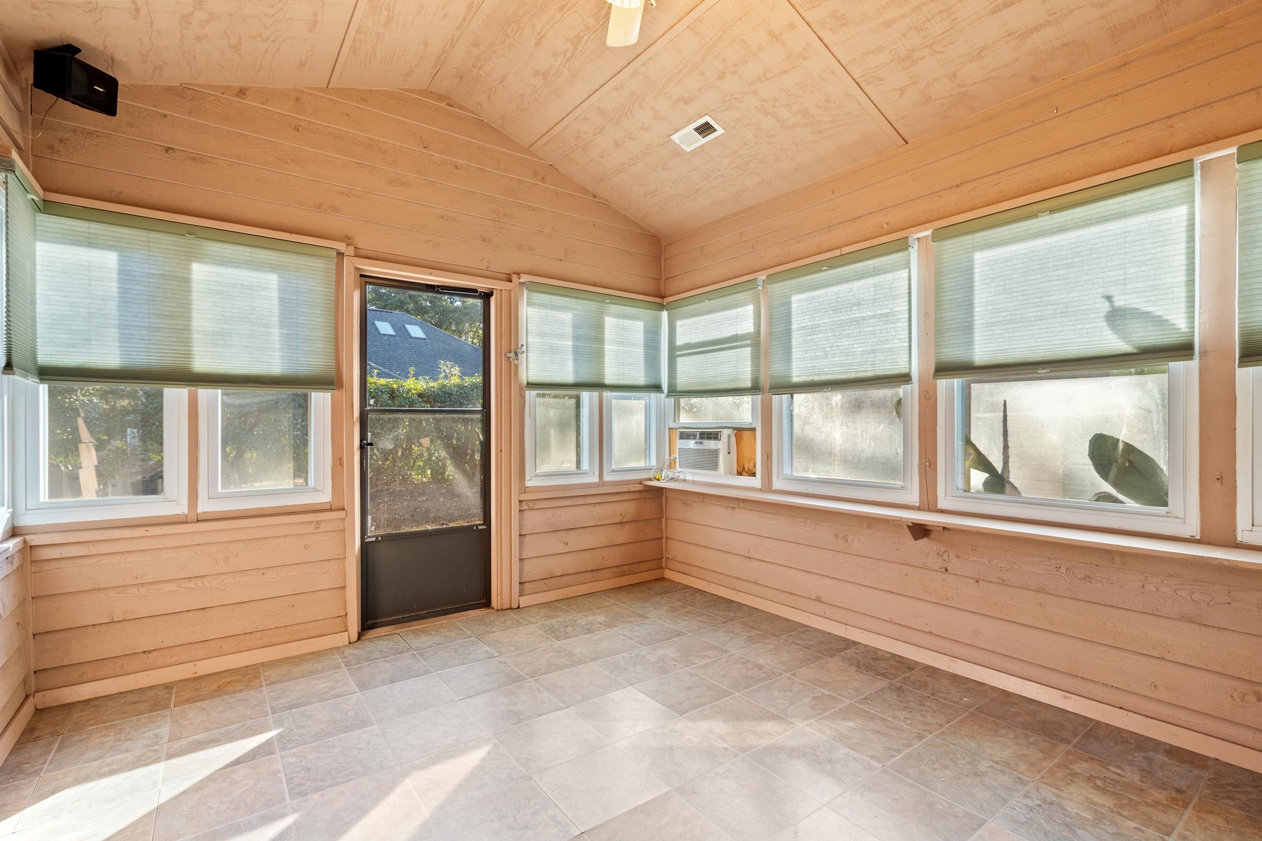 3106 Robyn Court Little River, SC 29566 - Photo 30 of 37 Unfurnished sunroom featuring wood walls, vaulted ceiling, and wood ceiling