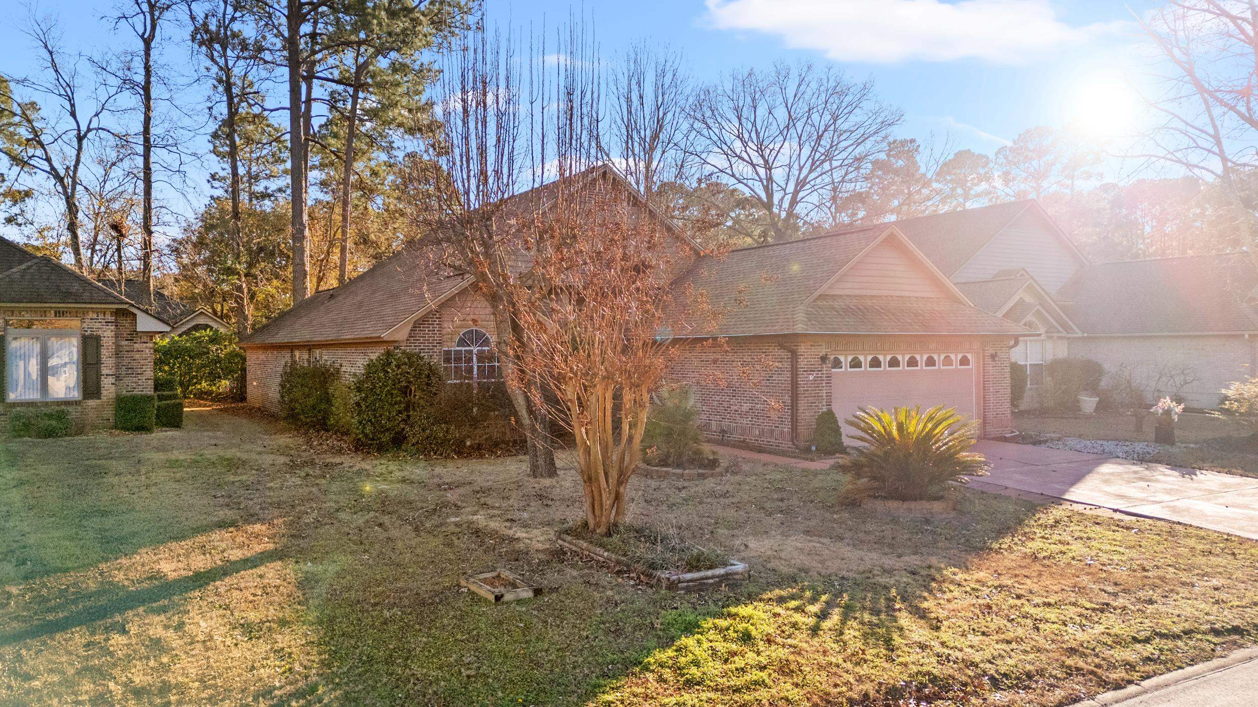 3106 Robyn Court Little River, SC 29566 - Photo 3 of 37 View of front of house with brick siding, driveway, roof with shingles, and an attached garage