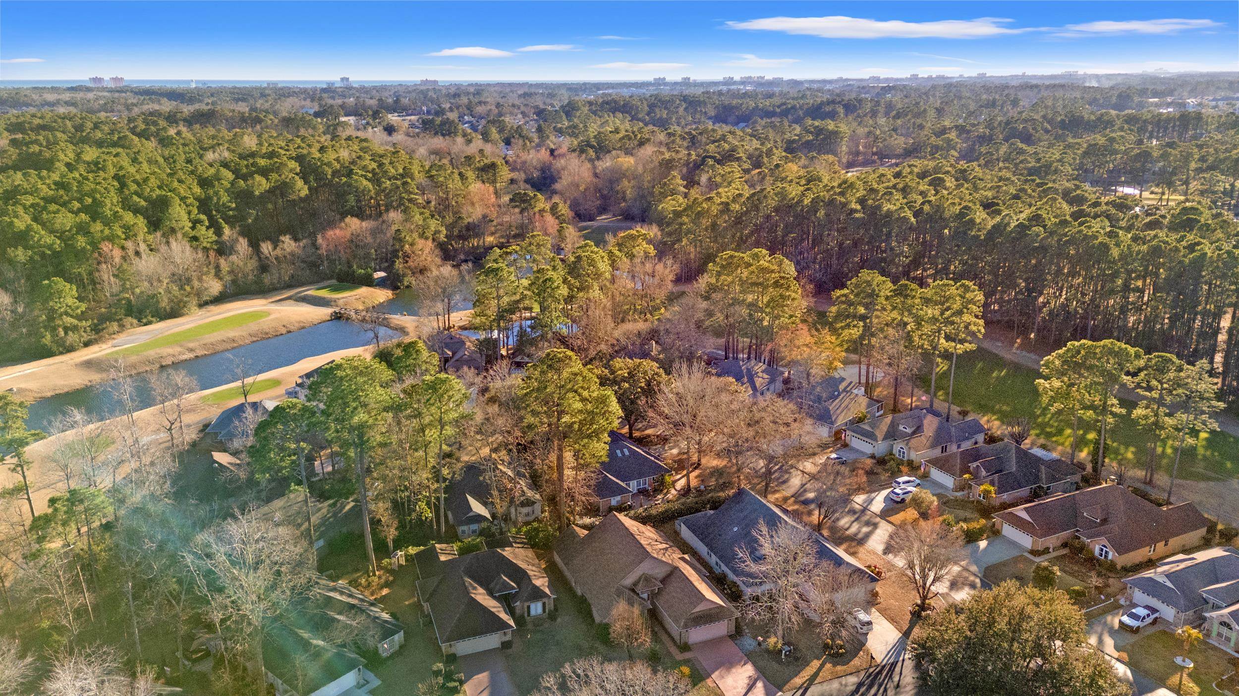 3106 Robyn Court Little River, SC 29566 - Photo 36 of 37 Aerial view of property's location featuring a large body of water and nearby suburban area