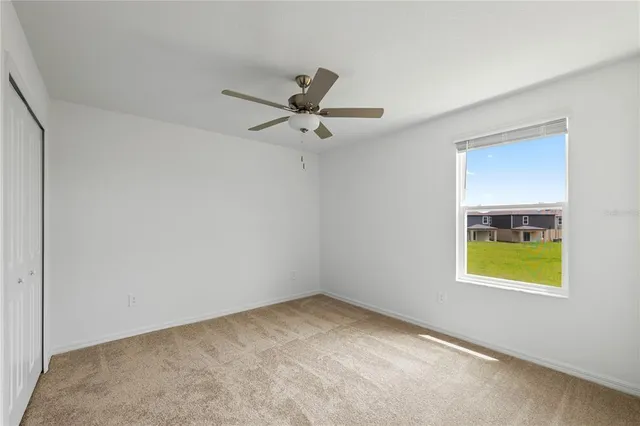 a view of a ceiling fan in a room