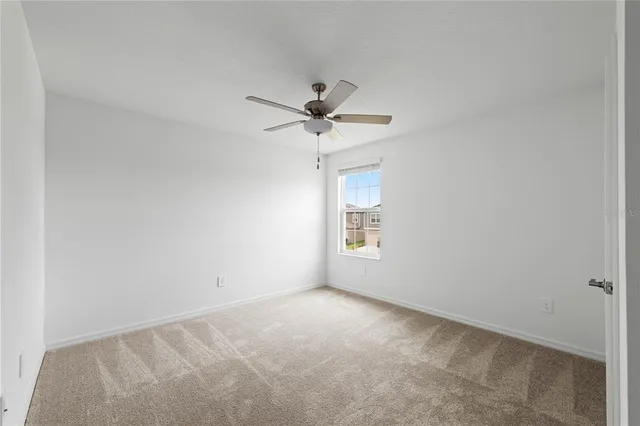 a view of an empty room and a window