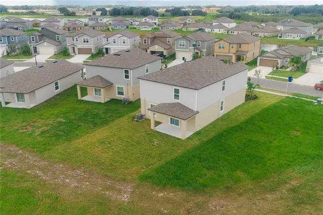 an aerial view of a house with a garden