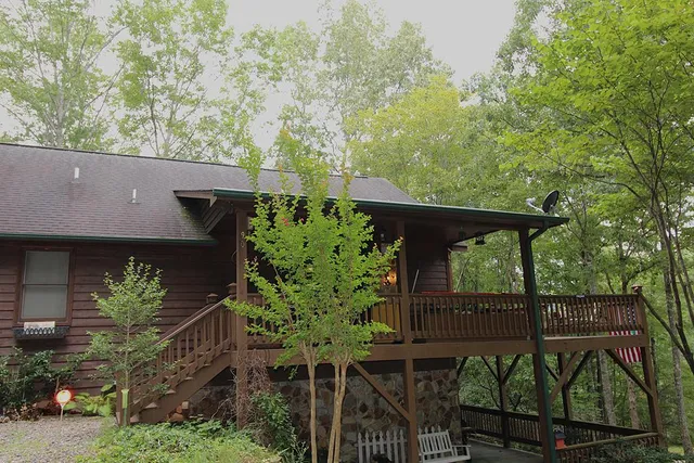 a backyard of a house with lots of trees