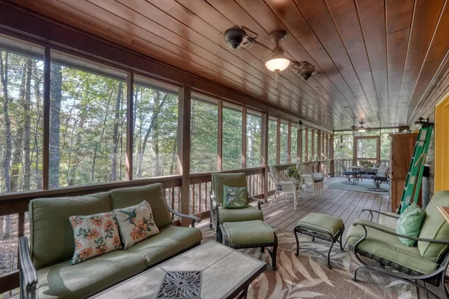 a view of balcony with wooden floor and outdoor seating