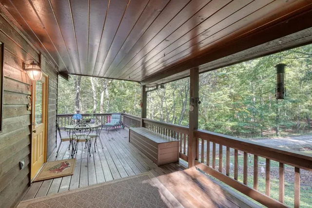 a view of a chair and tables in the balcony