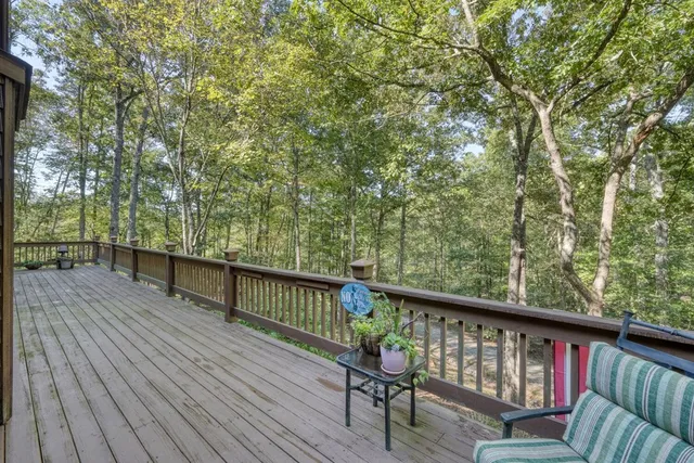 a view of a wooden deck with a bench
