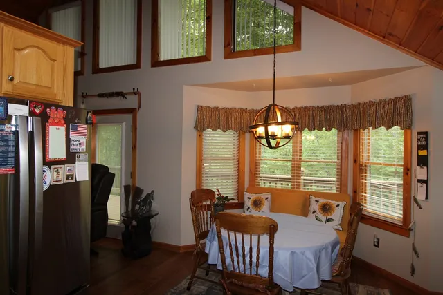 a dining room with furniture and window